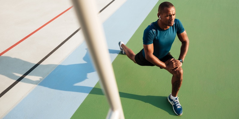 top-view-portrait-young-african-sportsman-doing-stretching-1